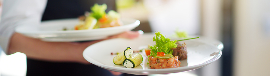 Food Service Division close up on plates being served by waiter