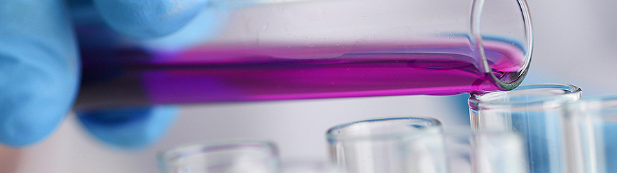 Research Development Division purple substance poured from one beaker to another