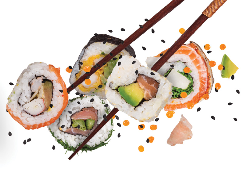 Pieces of delicious Japanese sushi frozen in the air.