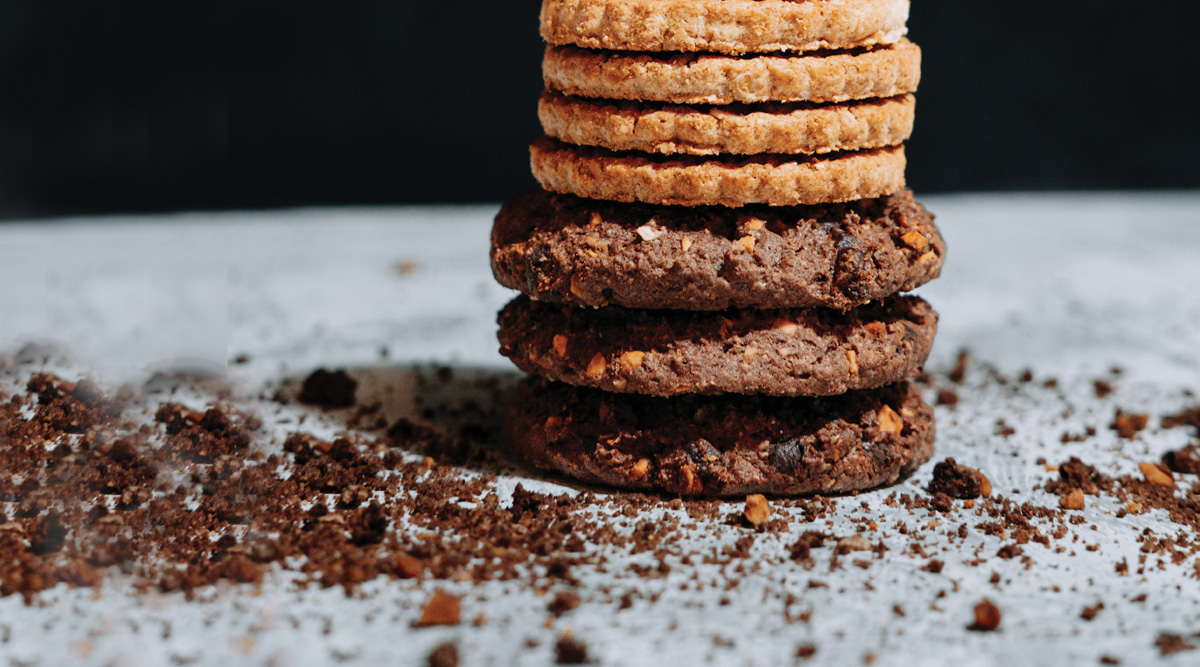 Close up stack of cookies and crumbs