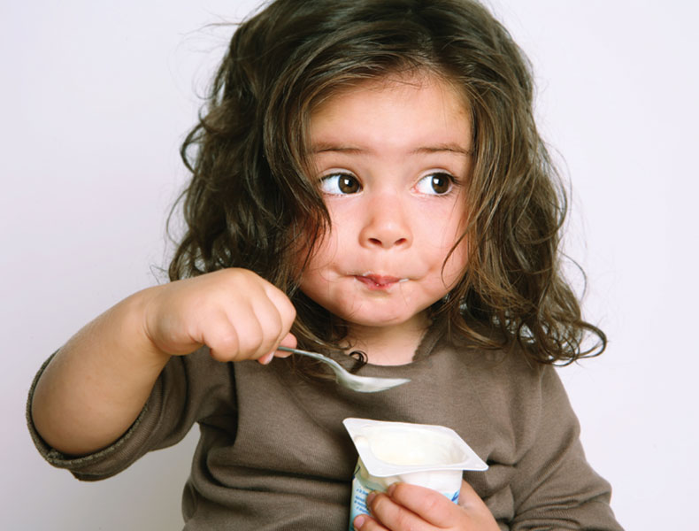 girl eating yogurt