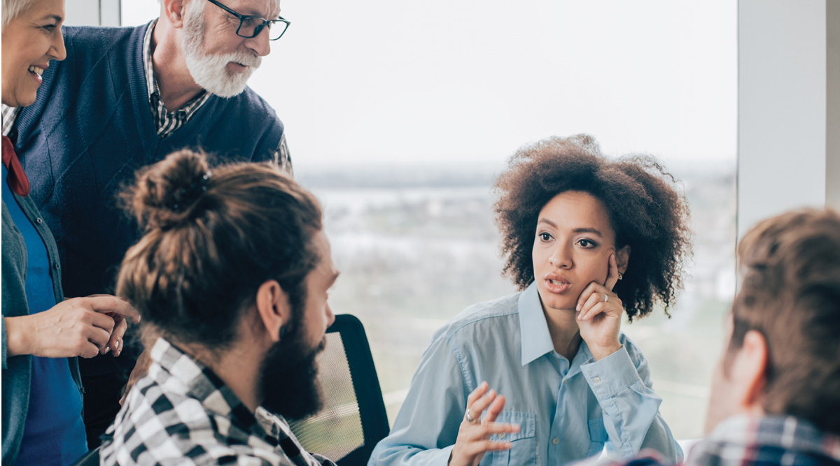 Coworkers talking at their place of work