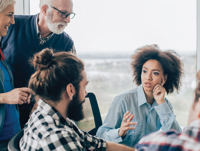 Coworkers talking at their place of work