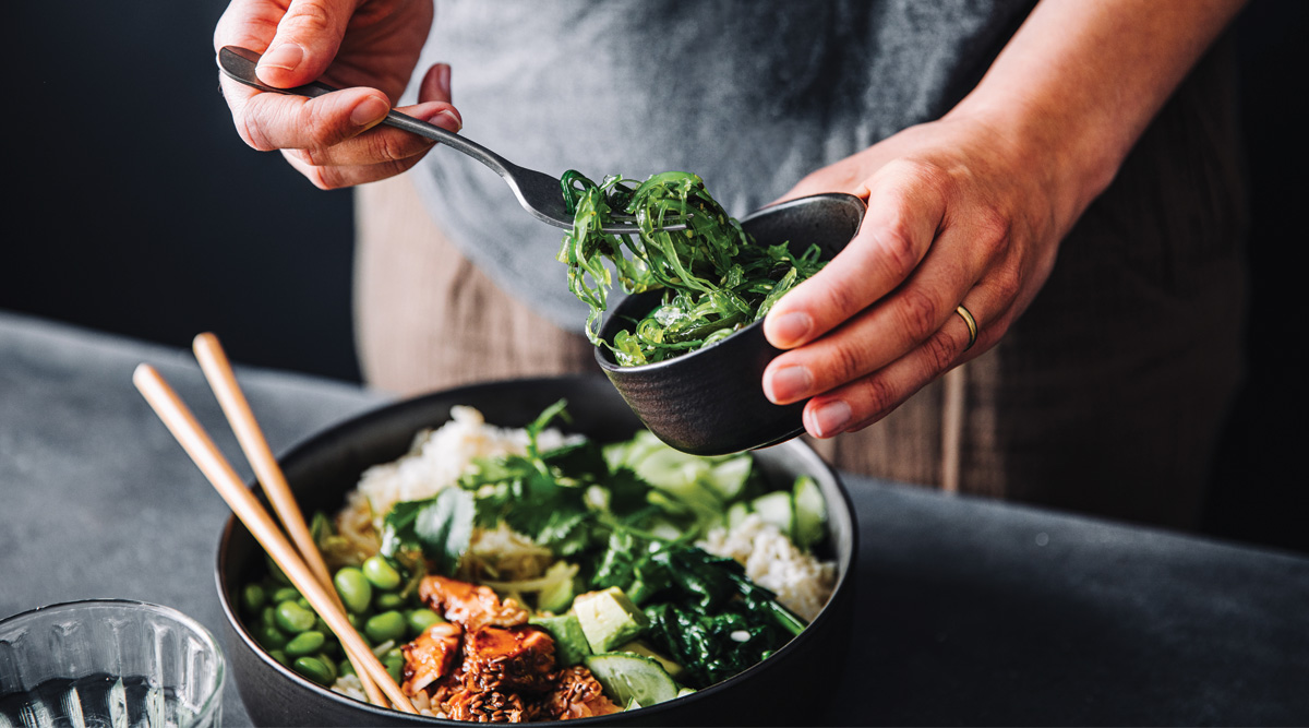 Close-up of woman eating omega 3 rich salad. 