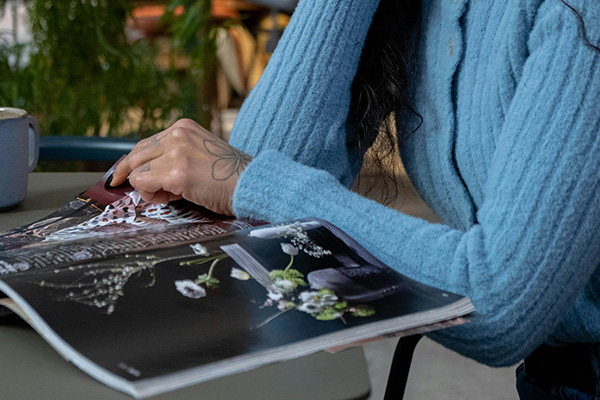 Woman flipping through a magazine.